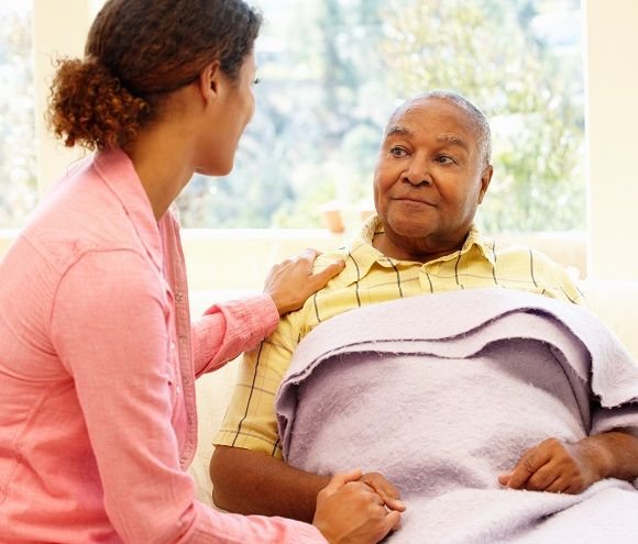 Woman looking after sick father